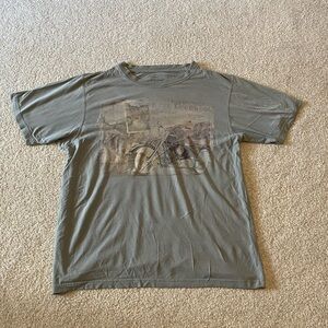 Green Reel Legends Outdoor T-Shirt. Size Large. Good condition. Slightly faded.